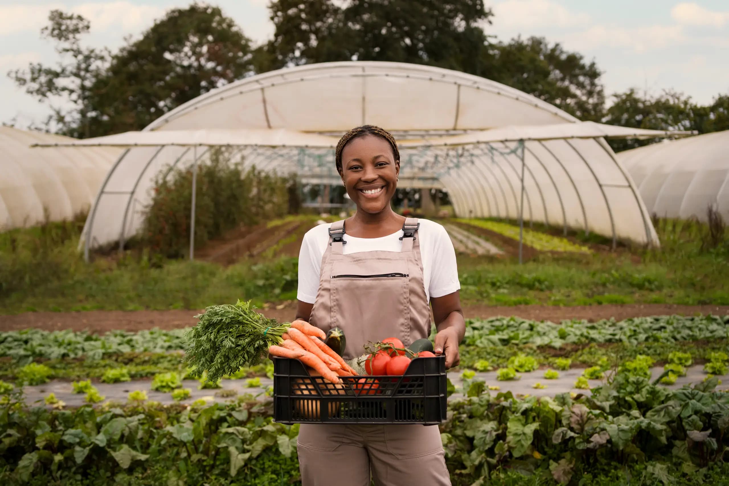 Agricultural worker holding fresh produce